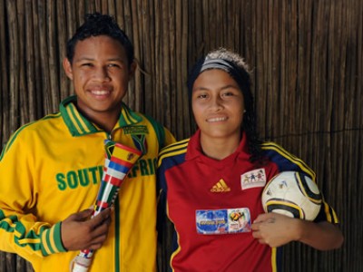 man and woman in soccer jerseys