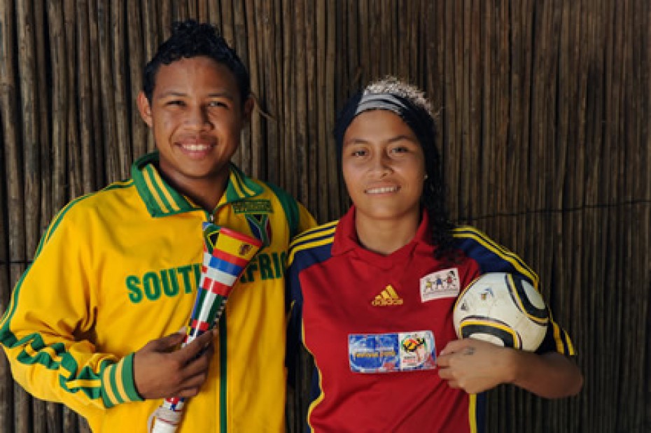 man and woman in soccer jerseys