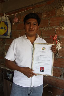 boy holding certificate