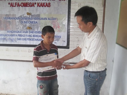 boy receiving award