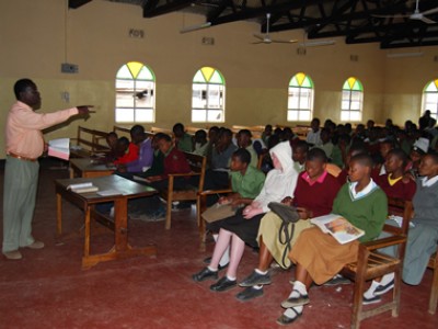 group of children being taught in church