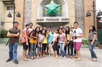 group of teens standing outside church in Philippines