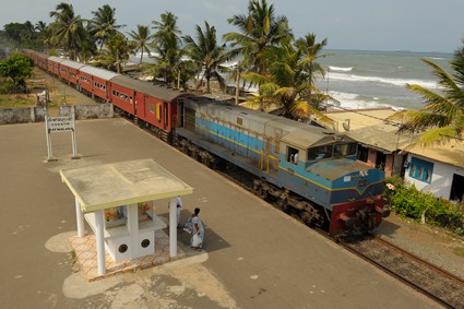 train at a railway station along the coastline