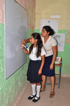 girl writing on white board