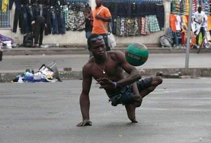 man with a physical disability playing with a soccer ball