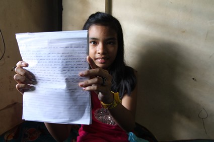 girl holding a letter
