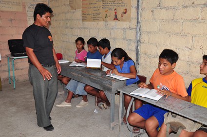 children at tables in classroom