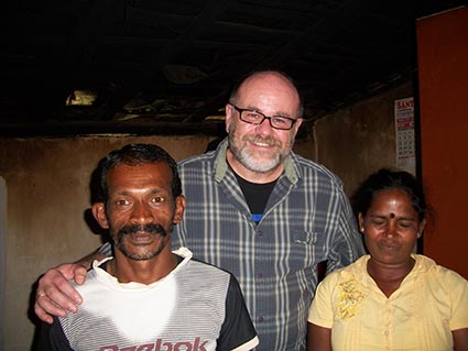 two men standing with a woman