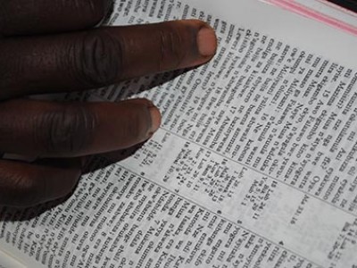 hand on open bible