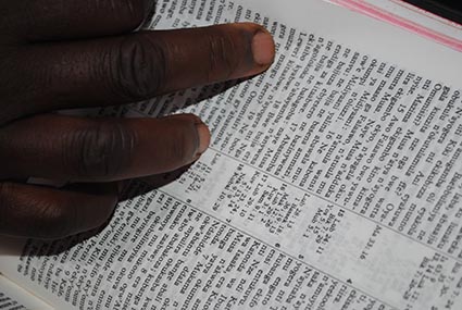 hand on open bible