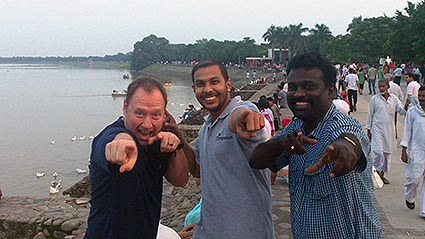 group of men pointing at camera