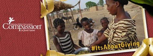 woman sharing a plate of food with some children