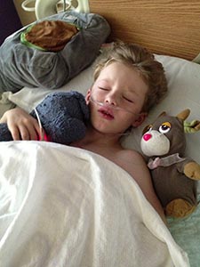 young boy in hospital bed