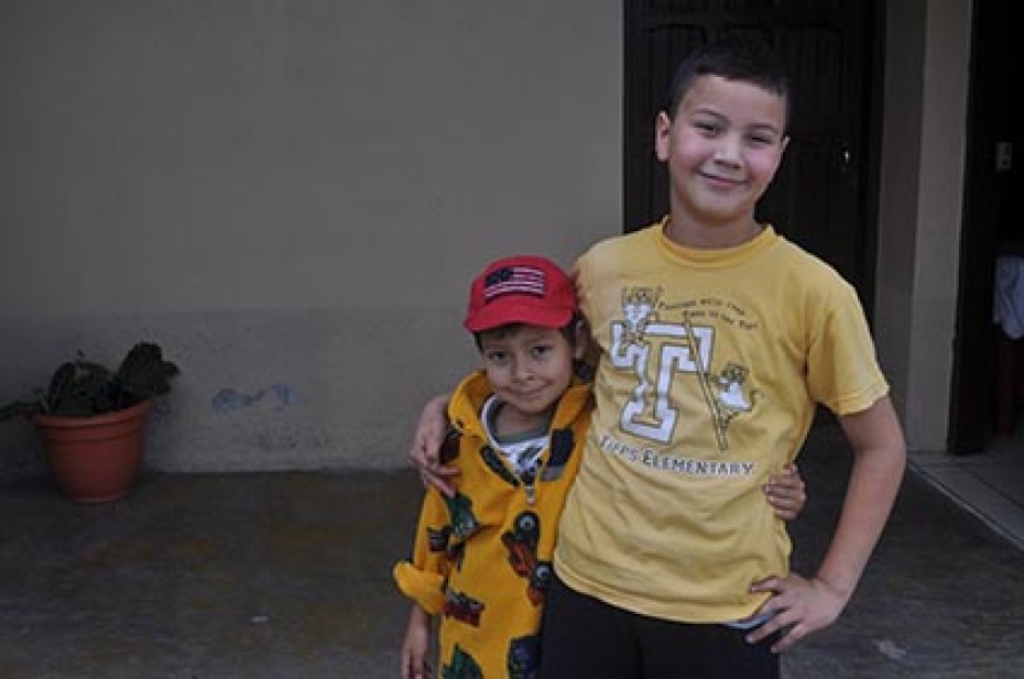 two Honduran boys with arms around each other