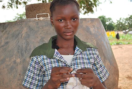 Young girl standing outside.