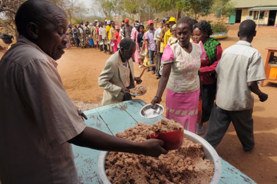 people waiting in line for food