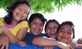 four smiling children