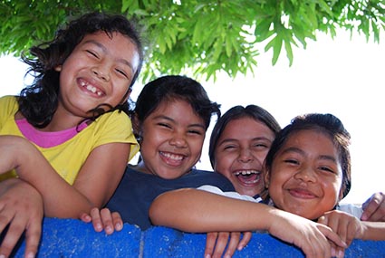 four smiling children