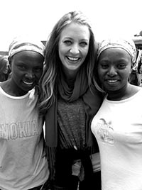 woman standing between two girls