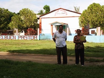 man and woman standing outside a church