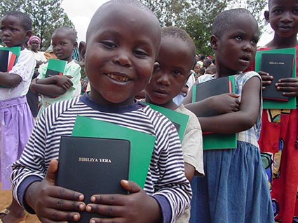 group of children holding Bibles