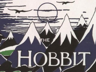 Black and white poster titled Hobbit with mountains and a sunset in the backgroundntains and a sunset titled Hobbit