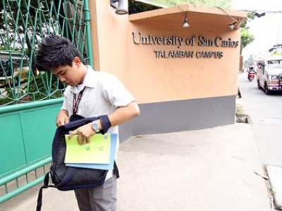 young man outside university