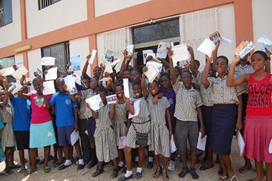 group of children holding up letters