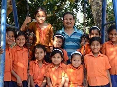 group of children wearing orange shirts