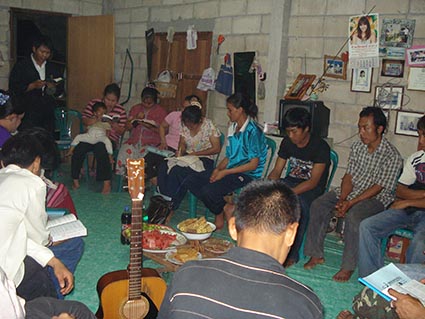 group of Thai men and women sitting in a circle