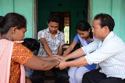 piyush praying with family