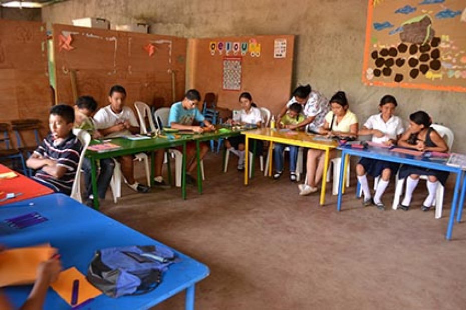 teens at tables in classroom