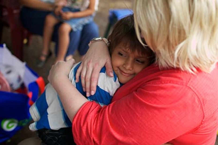 woman embracing boy