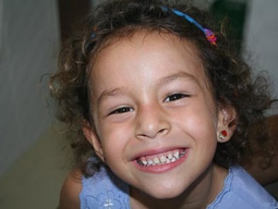 smiling girl showing her teeth
