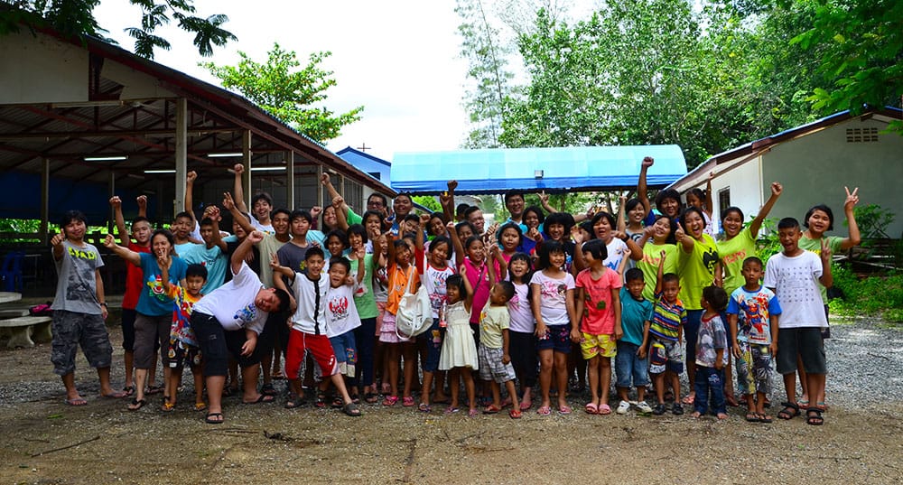 large group of children posing for photo