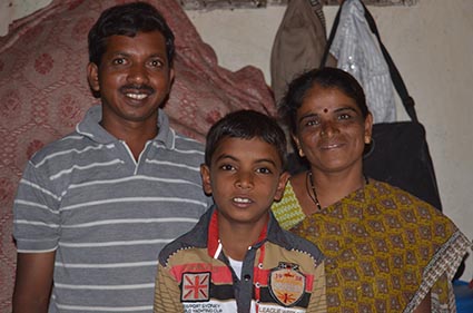 man and woman and child posing for photo