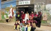 Women and children outside of church