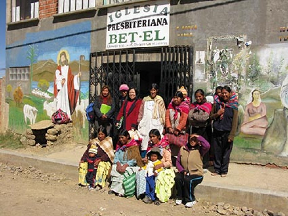 Women and children outside of church