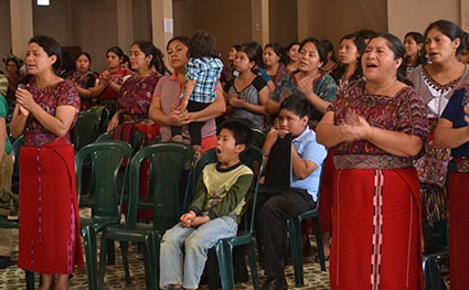 A group of women and children singing