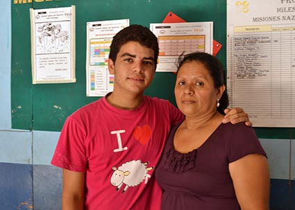 young man with arm around older woman