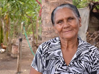 elderly women next to trees