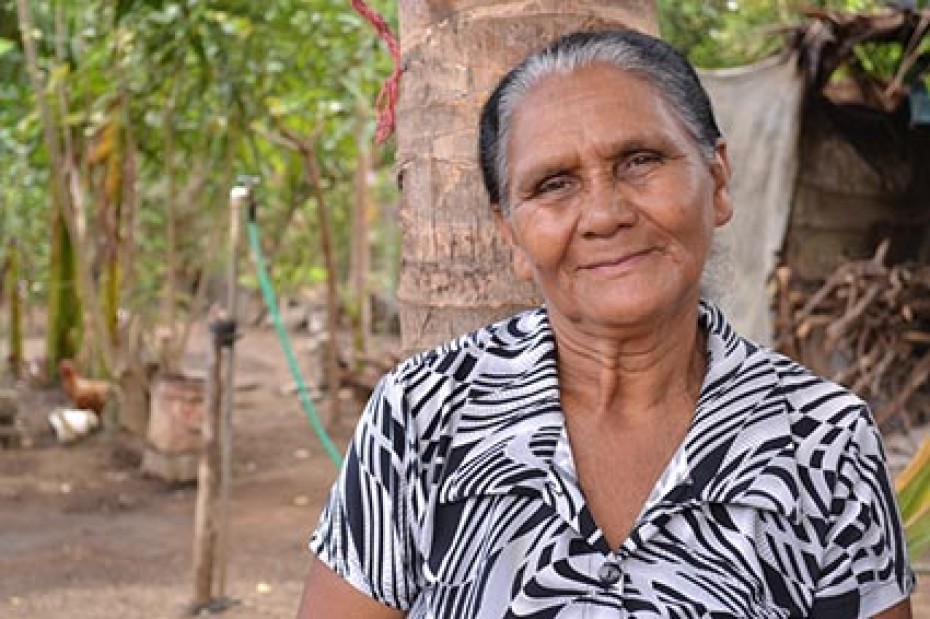 elderly women next to trees