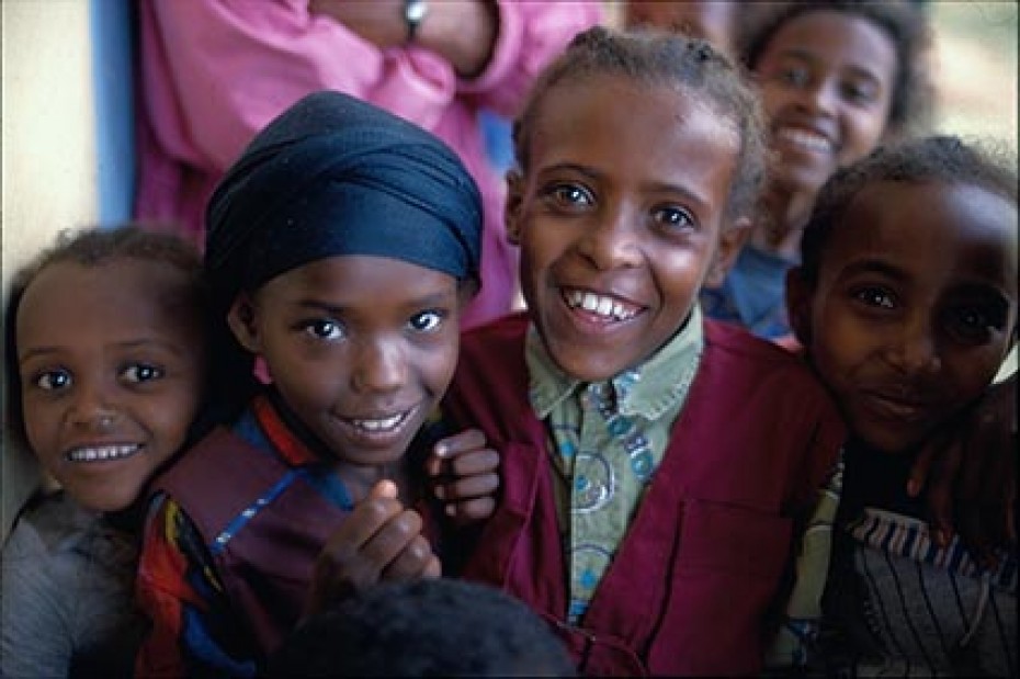 four smiling children