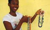 young woman holding handmade jewelry