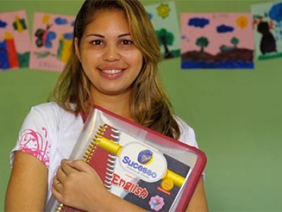 A young student holding a binder