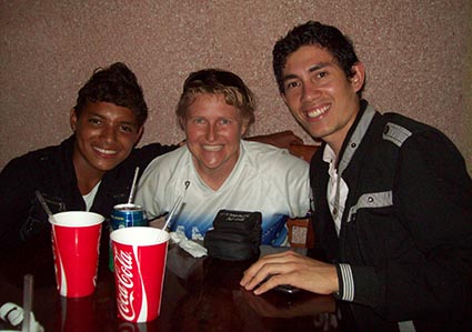 Three young people sitting at a table.