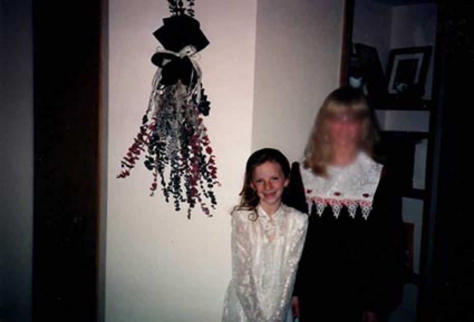 two young ladies wearing fancy dresses