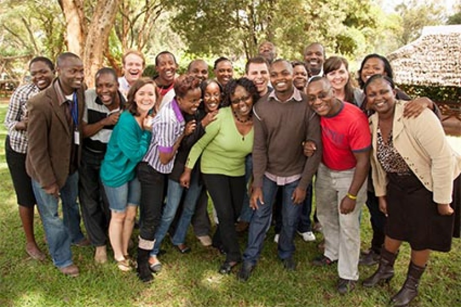 large group of adults smiling and laughing