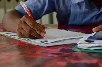 person writing a letter