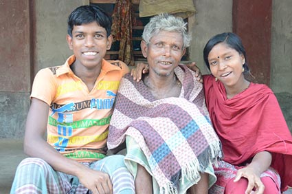 boy and girl sitting with elderly man